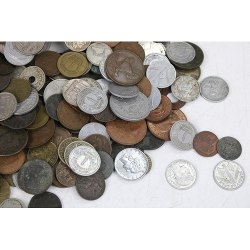 101 - A collection of mixed British pre decimal and world coins to include a selection of silver examples ... 