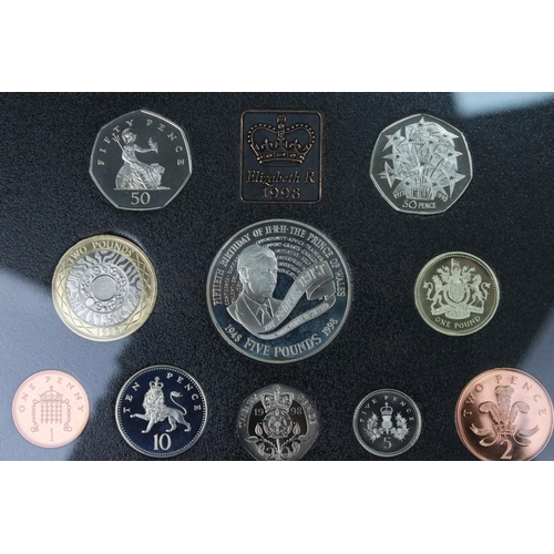 106 - A collection of four Royal Mint annual year sets to include brilliant uncirculated and proof example... 