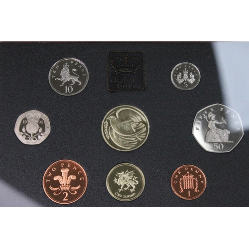 106 - A collection of four Royal Mint annual year sets to include brilliant uncirculated and proof example... 