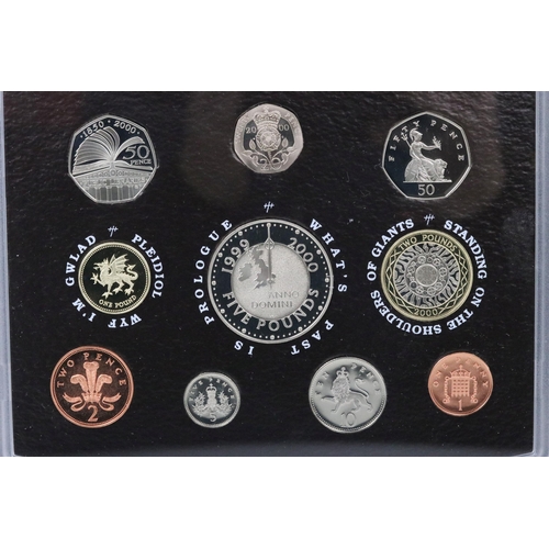 13 - A collection of four British Royal Mint collectors coin annual year sets to include 2000, 2001, 2002... 