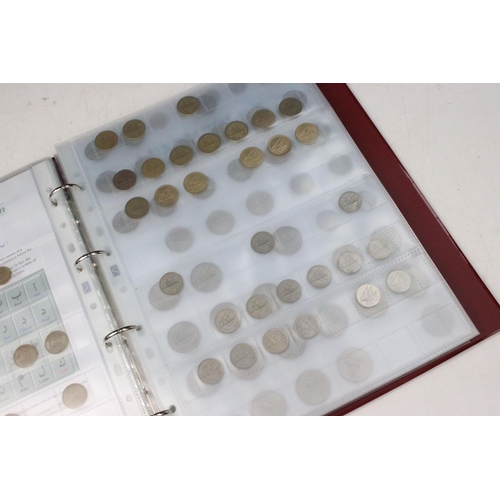 135 - A very large collection of mixed World coins in alphabetical order within six collectors albums.