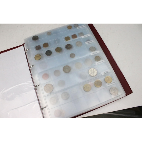 135 - A very large collection of mixed World coins in alphabetical order within six collectors albums.