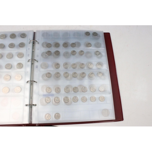 135 - A very large collection of mixed World coins in alphabetical order within six collectors albums.