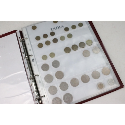 135 - A very large collection of mixed World coins in alphabetical order within six collectors albums.