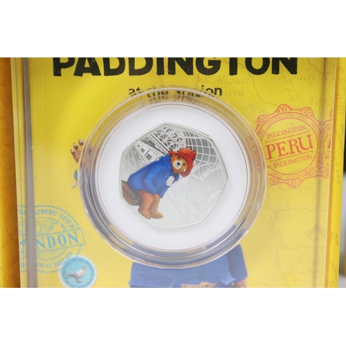 231 - Two Royal Mint 2018 Paddington Bear United Kingdom silver proof 50p coins to include 'At The Palace'... 