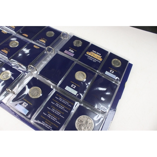 235 - A collection of Queen Elizabeth II and King Charles III brilliant uncirculated coins within a change... 