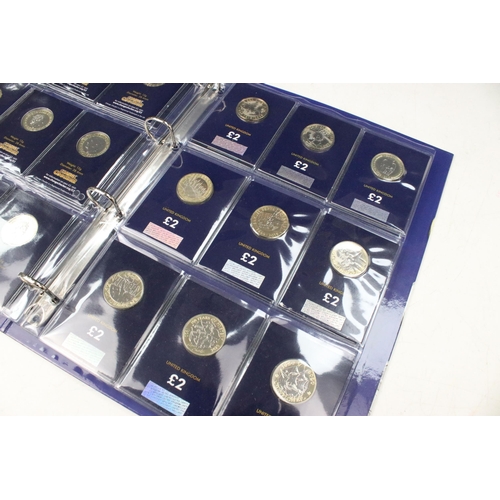 241 - A collection of Royal Mint United Kingdom £2 collectors coins contained within a change checker albu... 