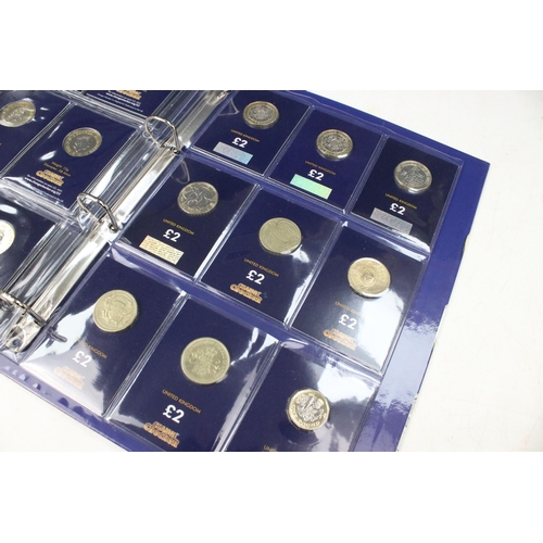 241 - A collection of Royal Mint United Kingdom £2 collectors coins contained within a change checker albu... 