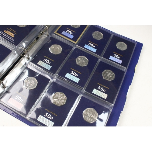 242 - A large collection of Royal Mint United Kingdom 50p collectors coins contained within two change che... 