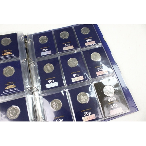 242 - A large collection of Royal Mint United Kingdom 50p collectors coins contained within two change che... 