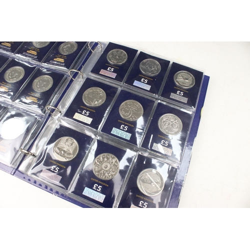 243 - A large collection of Royal Mint United Kingdom brilliant uncirculated £5 coins within a change chec... 