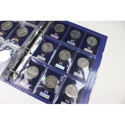 243 - A large collection of Royal Mint United Kingdom brilliant uncirculated £5 coins within a change chec... 