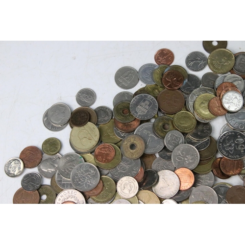 258 - A collection of mixed World coins to include a small quantity of silver examples.