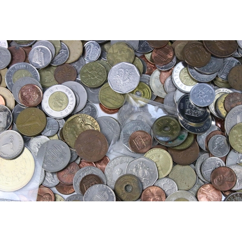 258 - A collection of mixed World coins to include a small quantity of silver examples.