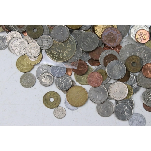 258 - A collection of mixed World coins to include a small quantity of silver examples.