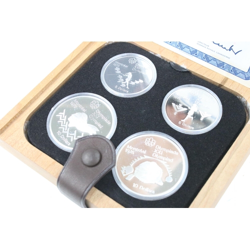 275 - A collection of seven Canadian 1976 Olympic silver proof coin sets, all encapsulated within original... 