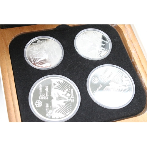 275 - A collection of seven Canadian 1976 Olympic silver proof coin sets, all encapsulated within original... 