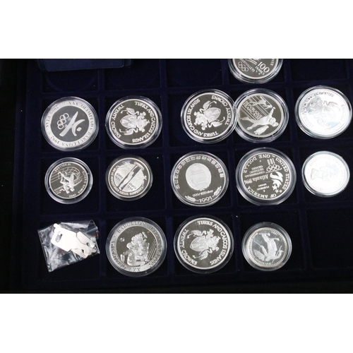 290 - A collection of thirty seven fine silver and sterling silver proof Olympic coins, all encapsulated w... 