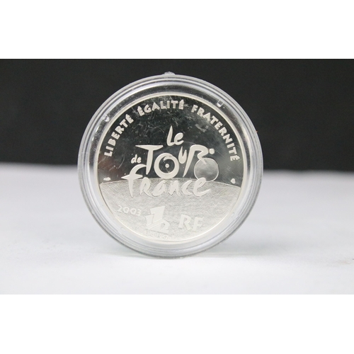 299 - A collection of four 2003 Tour De France centenary commemorative silver coins.