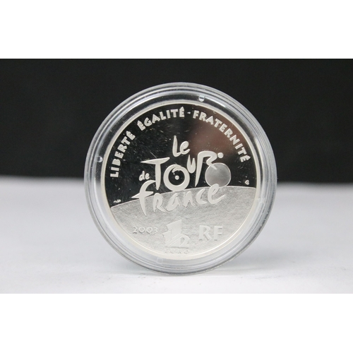 299 - A collection of four 2003 Tour De France centenary commemorative silver coins.