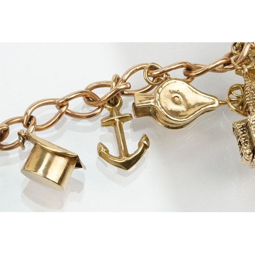 100 - 9ct gold charm bracelet with 14 gold charms on an oval link bracelet with spring ring clasp. Marked ... 