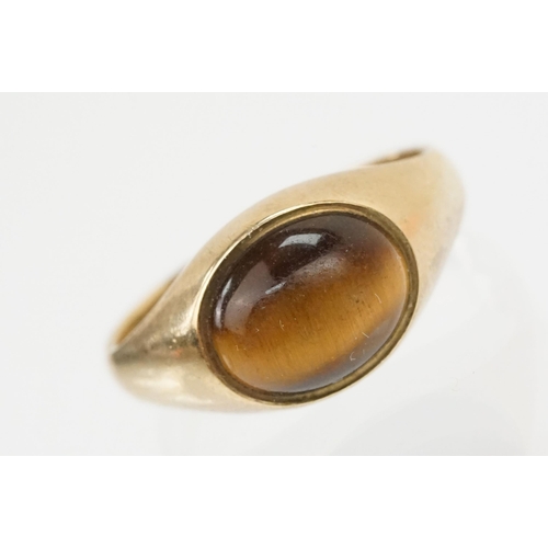 112 - 9ct gold and tigers eye set ring and necklace. The ring being set with an oval tigers eye cabochon (... 