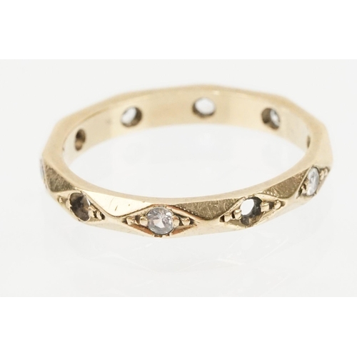 170 - 9ct gold and white stone eternity ring set with round cut white stones in diamond shaped settings. M... 