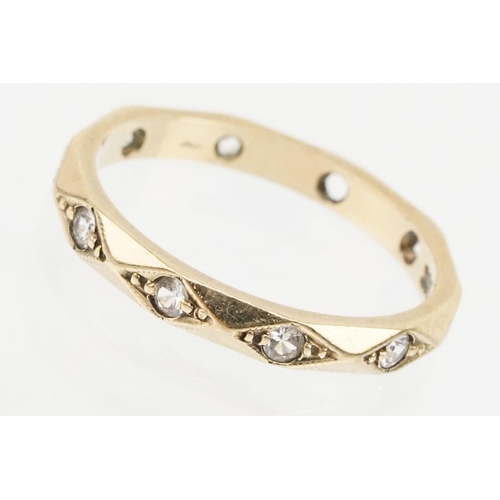 170 - 9ct gold and white stone eternity ring set with round cut white stones in diamond shaped settings. M... 