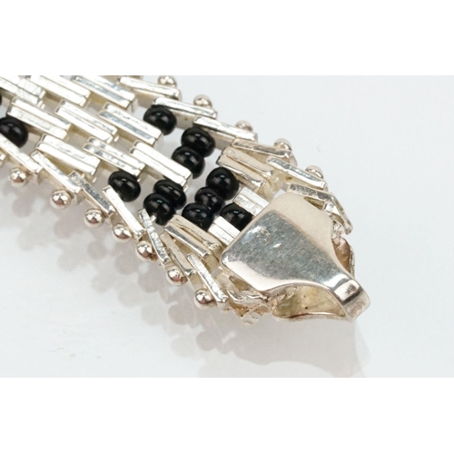 202 - Silver and black onyx bead necklace and bracelet suite. The necklace constructed from herringbone li... 