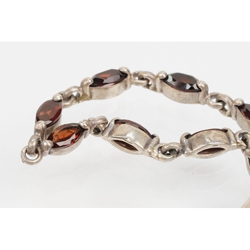 204 - Group of silver jewellery to include a garnet set collar necklace, hinged bangle bracelet (hallmarke... 