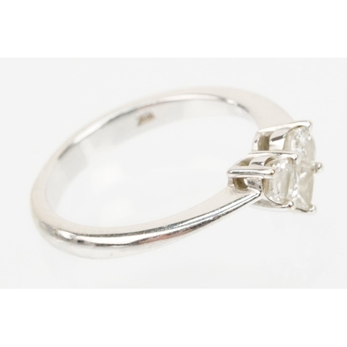 206 - 18ct white gold and diamond ring. The ring set with three diamonds cut into a heart shape. Marked 18... 