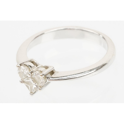 206 - 18ct white gold and diamond ring. The ring set with three diamonds cut into a heart shape. Marked 18... 