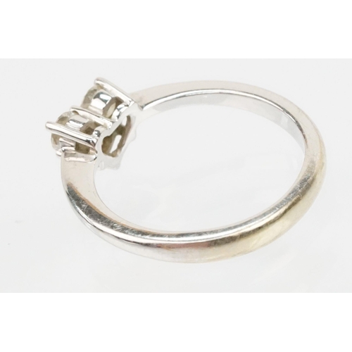 206 - 18ct white gold and diamond ring. The ring set with three diamonds cut into a heart shape. Marked 18... 