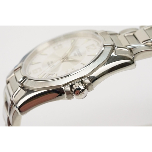 280 - Tissot PR 100 stainless steel wrist watch. The watch having a round face with white dial with arabic... 