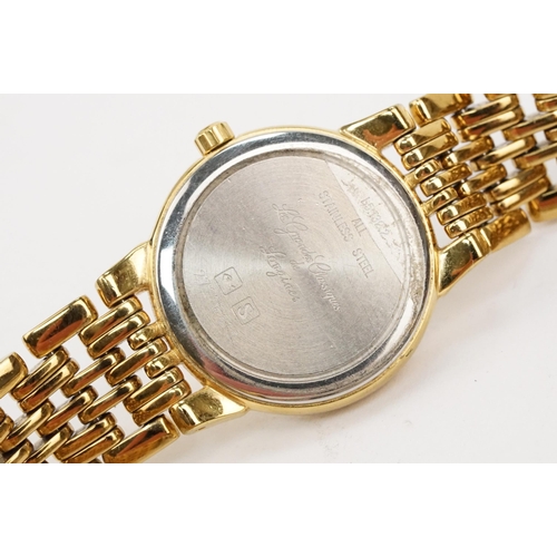 284 - Longines ladies wristwatch having a round gilt face with baton markers to the chapter ring and date ... 