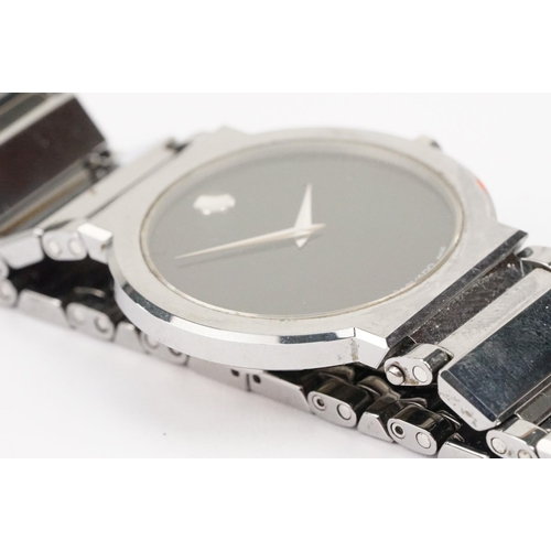 292 - Movado stainless steel wristwatch having a round black face with silver dot to twelve, mounted to a ... 