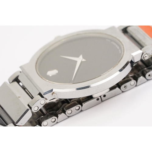 292 - Movado stainless steel wristwatch having a round black face with silver dot to twelve, mounted to a ... 