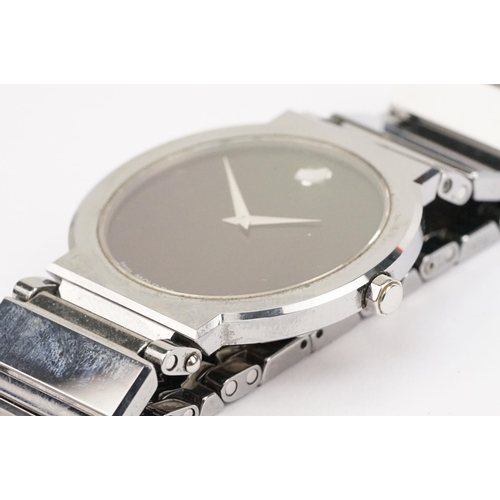 292 - Movado stainless steel wristwatch having a round black face with silver dot to twelve, mounted to a ... 