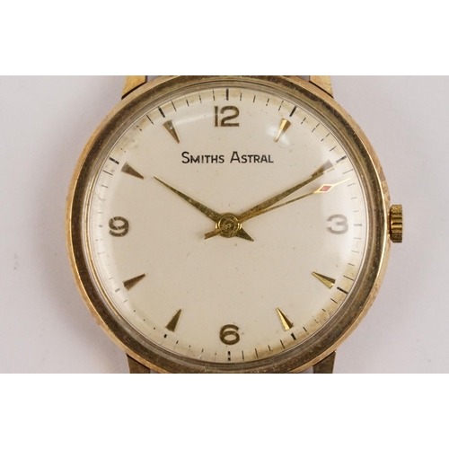 293 - 9ct gold case Smiths Astral wristwatch having a round face with triangular markings to chapter ring ... 