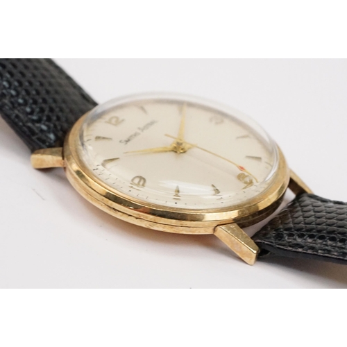 293 - 9ct gold case Smiths Astral wristwatch having a round face with triangular markings to chapter ring ... 