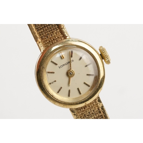 295 - 1970s 9ct gold Longines cocktail watch having a round face with baton markers to the chapter ring on... 