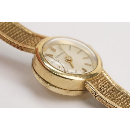 295 - 1970s 9ct gold Longines cocktail watch having a round face with baton markers to the chapter ring on... 