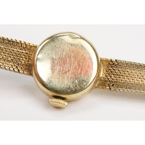 295 - 1970s 9ct gold Longines cocktail watch having a round face with baton markers to the chapter ring on... 