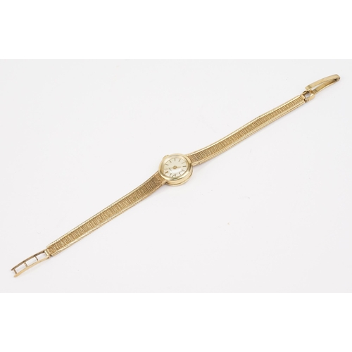 295 - 1970s 9ct gold Longines cocktail watch having a round face with baton markers to the chapter ring on... 