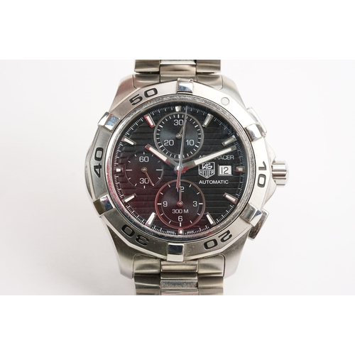 299 - Tag Heuer Aquaracer automatic wristwatch. The watch having a round black face with silver baton mark... 