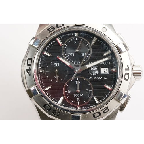 299 - Tag Heuer Aquaracer automatic wristwatch. The watch having a round black face with silver baton mark... 