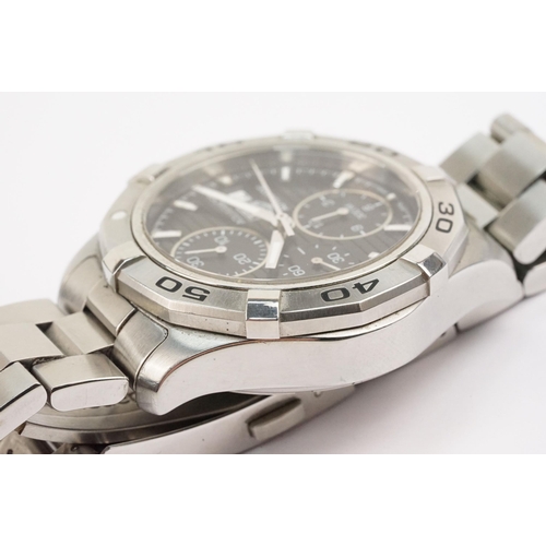 299 - Tag Heuer Aquaracer automatic wristwatch. The watch having a round black face with silver baton mark... 