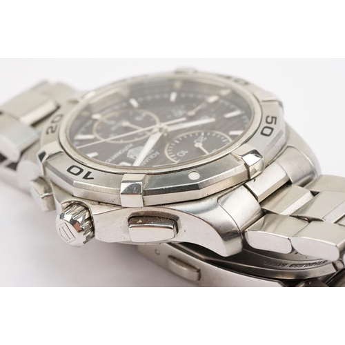 299 - Tag Heuer Aquaracer automatic wristwatch. The watch having a round black face with silver baton mark... 