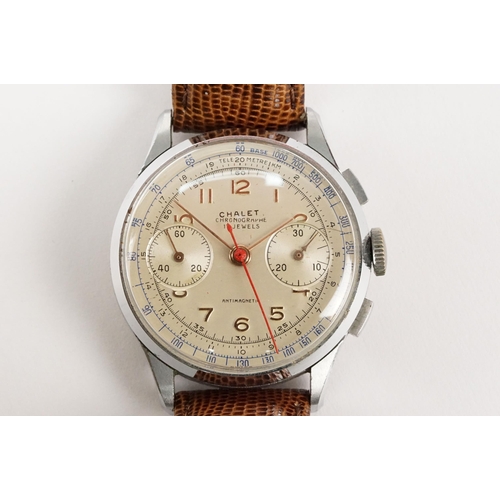 300 - Chalet chronograph mid 20th Century wrist watch having a white dial with gilt arabic numerals to the... 