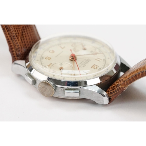 300 - Chalet chronograph mid 20th Century wrist watch having a white dial with gilt arabic numerals to the... 